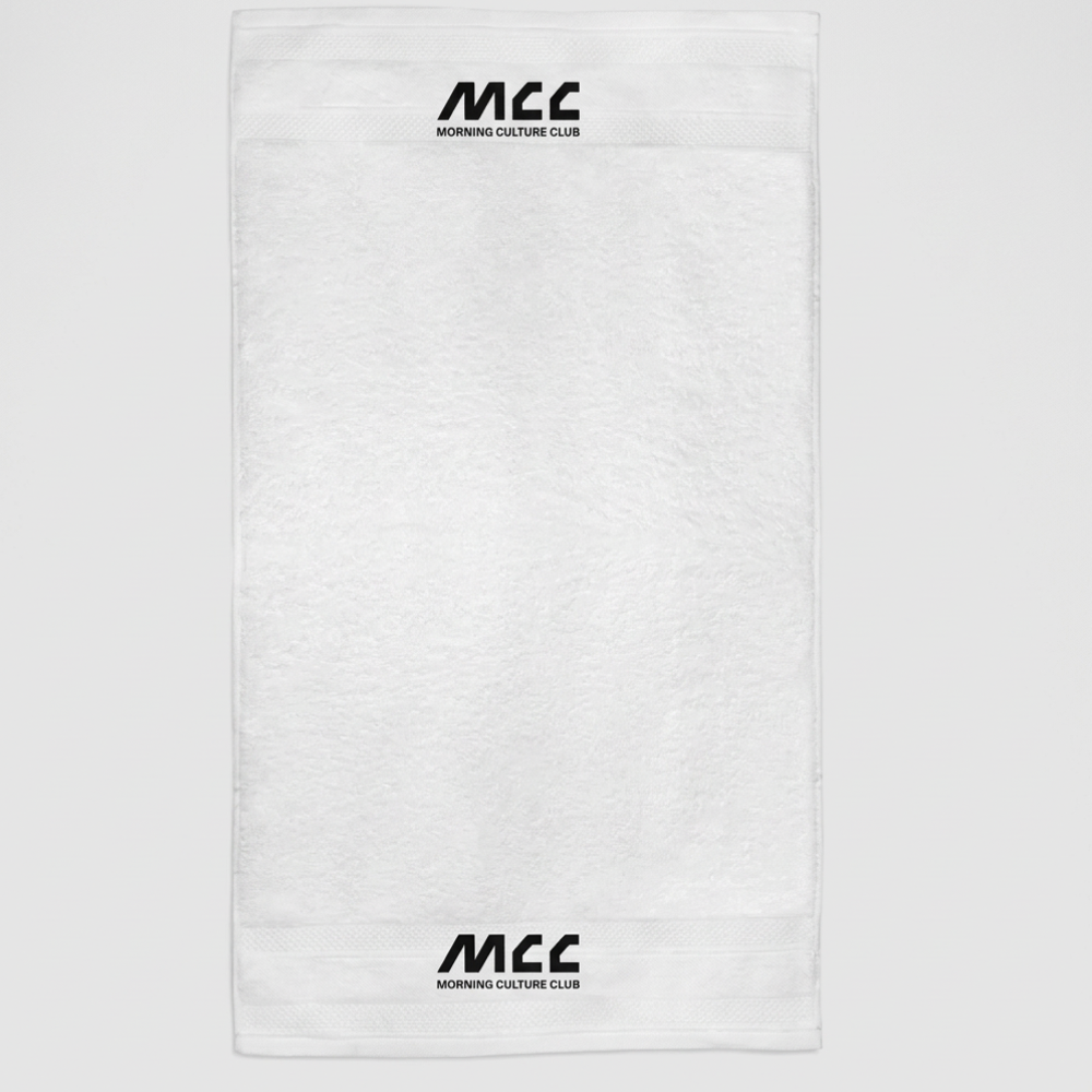 MCC 5-9 Active gym towel in white, flat lay, MCC wordmark woven into the border at both ends