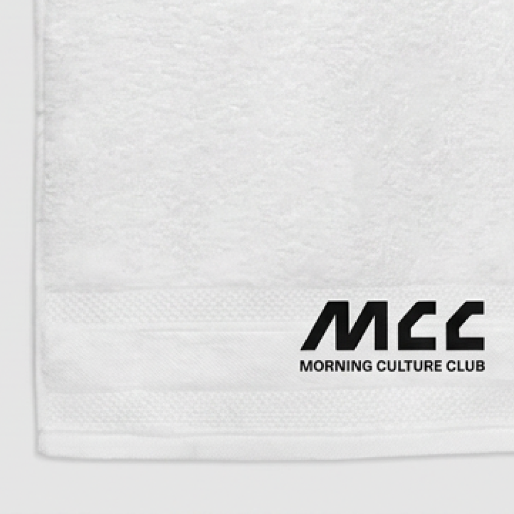 MCC 5-9 Active gym towel, close-up of the woven MCC wordmark and Morning Culture Club lettering on the cotton terry border